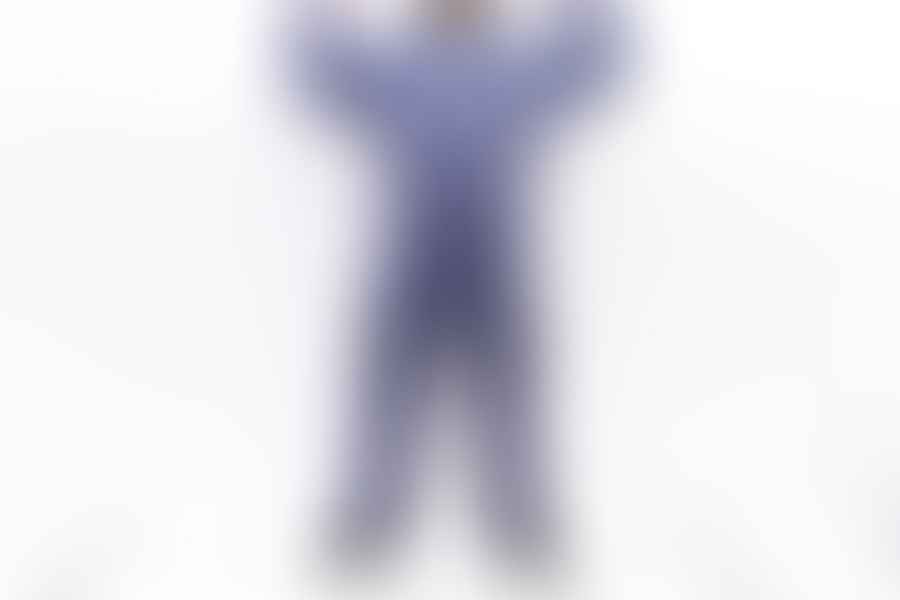 man in coveralls at a casual event