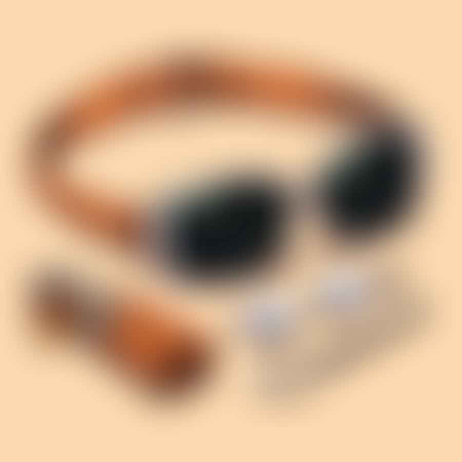 Y2K accessories including a <a href='https://www.amazon.com/dp/B07GN25HDX?ie=UTF8&tag=brandnearby-20' target='_blank' rel='nofollow noreferrer' class='lazyload amazon-link'>chunky belt</a> and sunglasses