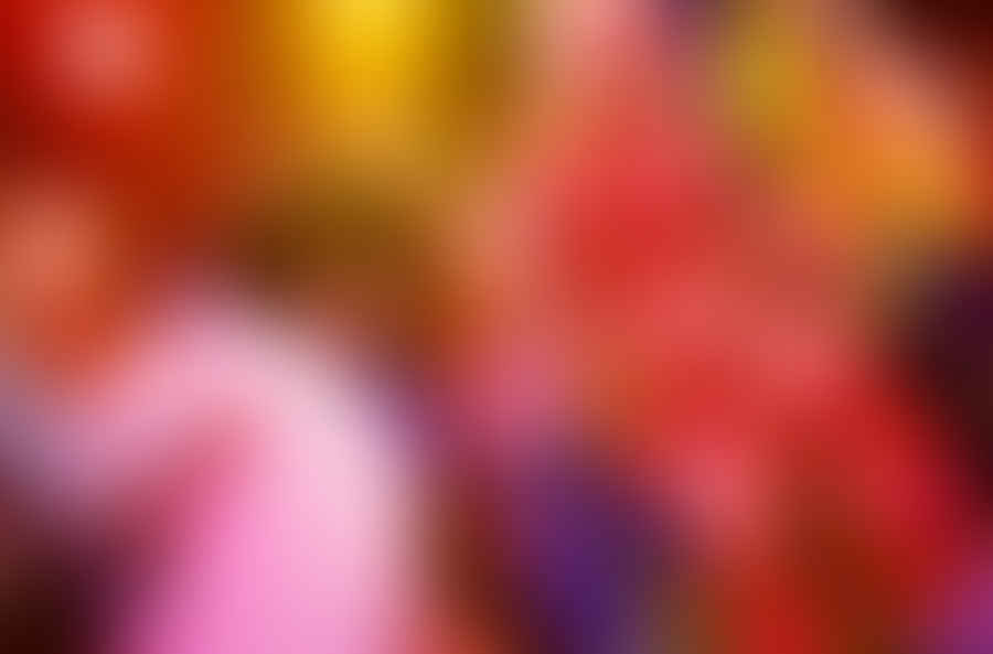 Group of people dressed in vibrant disco fashion outfits